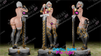 Three warrior figurines with armor and weapons on a dark background